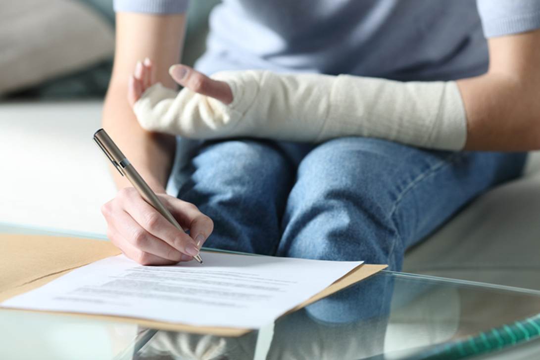 A person with a cast on her arm writing on a paper

AI-generated content may be incorrect.